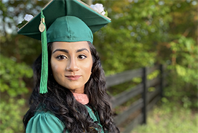 Asra Ahmad in graduation cap and gown